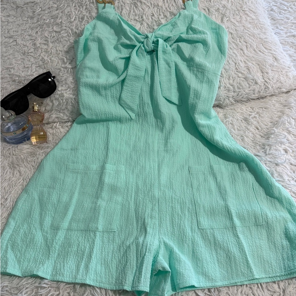 Vibrant Green Jumpsuit with Shoulder Straps and Bow Detail